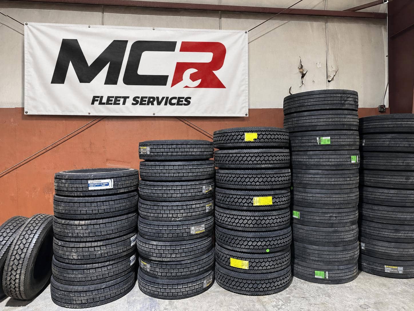 Racks of commercial truck tires in the MCR Fleet Services shop